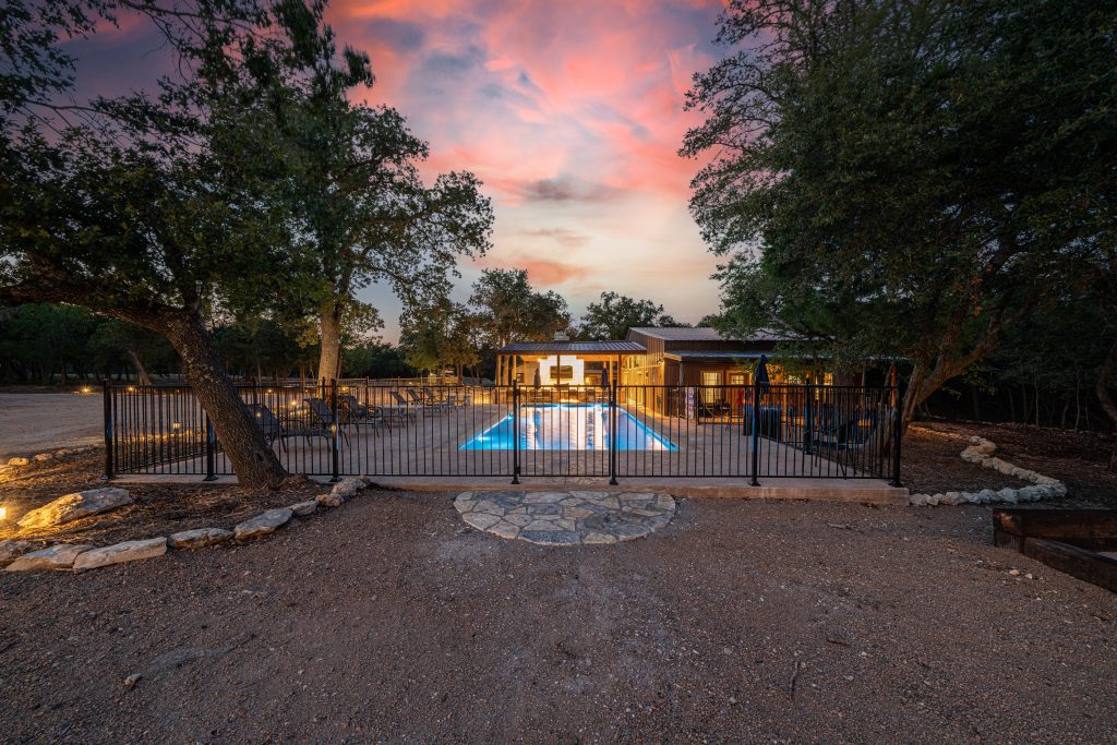 A peaceful view of vacation rentals in Wimberley Texas surrounded by nature, showcasing a relaxing hill country environment perfect for a weekend or extended getaway.