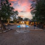 A peaceful view of vacation rentals in Wimberley Texas surrounded by nature, showcasing a relaxing hill country environment perfect for a weekend or extended getaway.