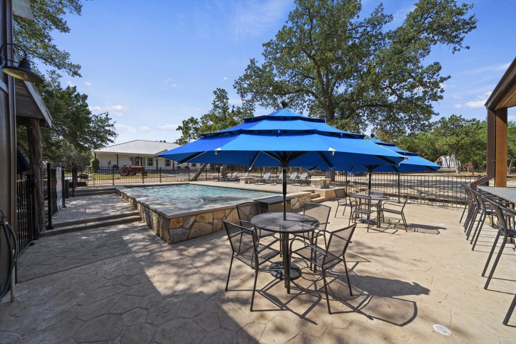 A peaceful view of vacation rentals in Wimberley Texas surrounded by nature, showcasing a relaxing hill country environment perfect for a weekend or extended getaway.