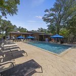 A peaceful view of vacation rentals in Wimberley Texas surrounded by nature, showcasing a relaxing hill country environment perfect for a weekend or extended getaway.