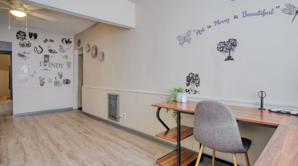 Monument Circle twilight view in downtown Indianapolis with Soldiers and Sailors Monument, vibrant city lights, and nearby short term rentals Indianapolis like Indy Nook Ave Unit