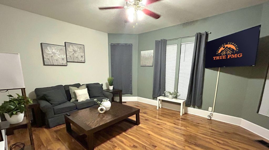 Modern living room with sectional sofa and decor promoting the 2026 Indy 500.